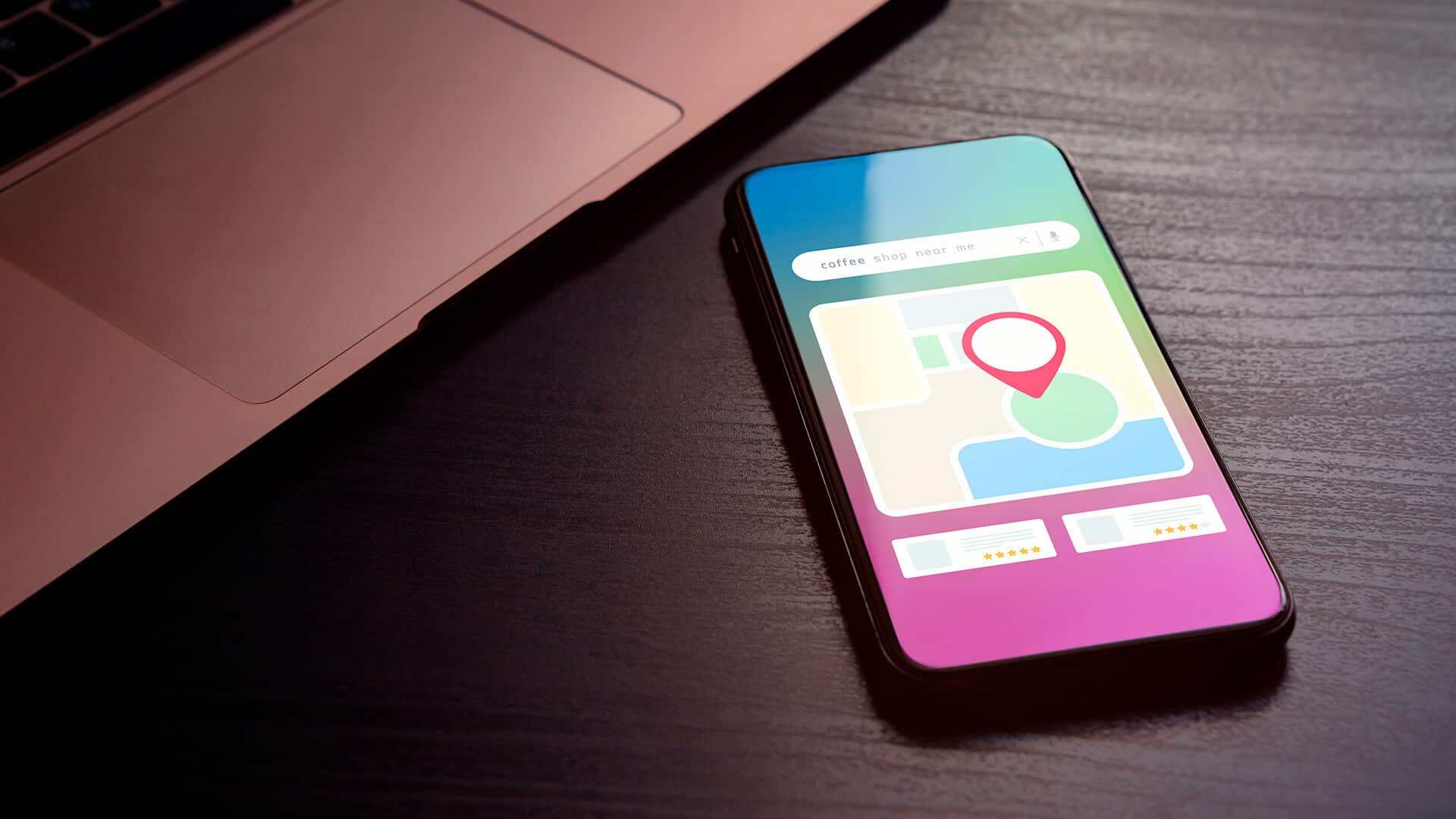 Smartphone displaying a map interface with a location pin and search bar for nearby coffee shops.